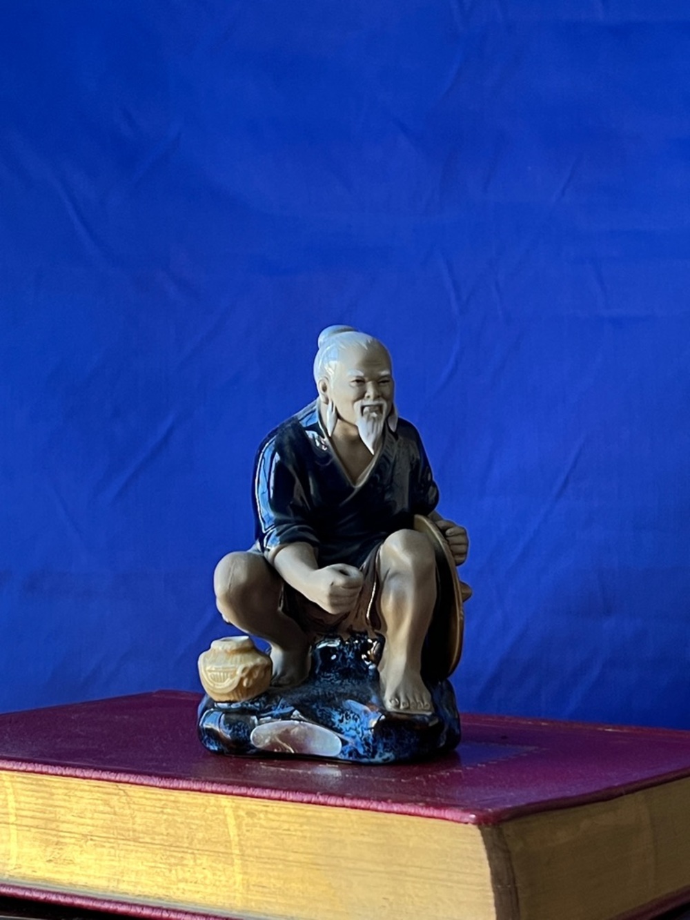 Blue and Cream Ceramic Elder Figurine Accent - Unbranded